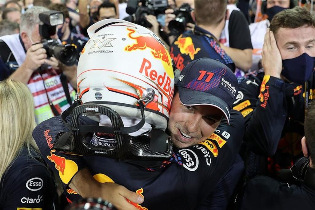Sergio Perez celebrates with Max Verstappen in Abu Dhabi.v1