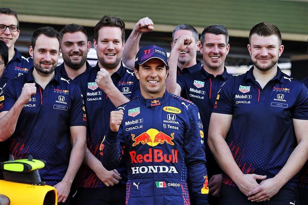 Sergio Perez with his Red Bull team and car in 2021.v1